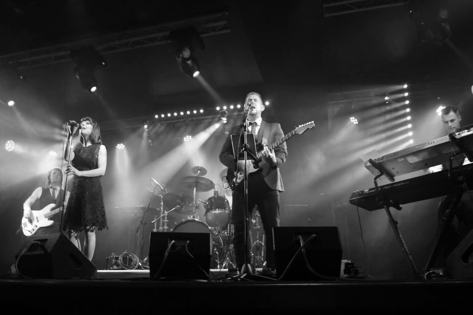 The Decades Band on stage performing